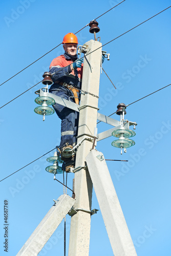 Photo: power electrician lineman at work on pole power electrician lineman at work on pole