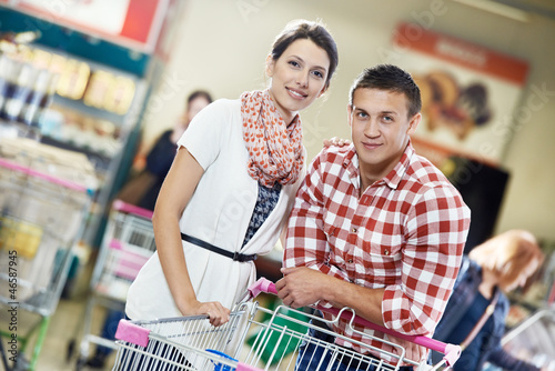 Photo: Family at food shopping in supermarket Family at food shopping in supermarket