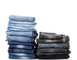 Many jeans stacked in a piles isolated on white