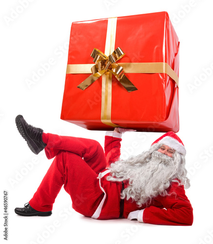 Photo: Santa Claus holding a big gift Santa Claus holding a big gift