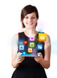 Young woman looking at modern tablet with colourful icons