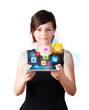 Young woman looking at modern tablet with colourful icons