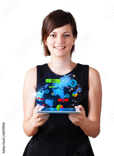 Photo: Young woman looking at modern tablet with colourful technology i Young woman looking at modern tablet with colourful technology i