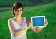 Young woman looking at modern tablet