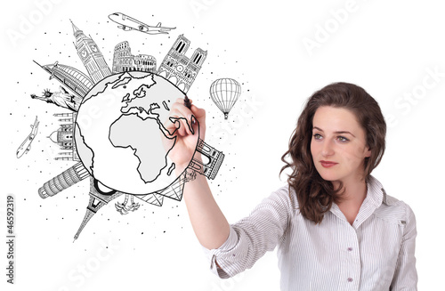Photo: Young woman drawing a globe on whiteboard Young woman drawing a globe on whiteboard