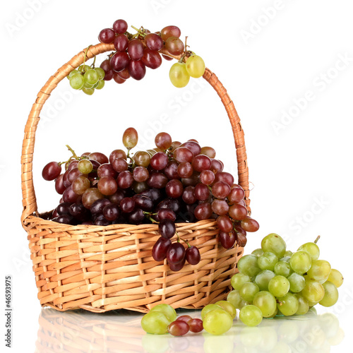 Photo: Delicious ripe pink and green grapes in basket isolated on Delicious ripe pink and green grapes in basket isolated on