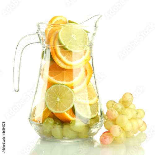 Photo: transparent jar with citrus fruits and grape, isolated on white transparent jar with citrus fruits and grape, isolated on white