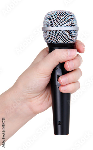 Photo: Black microphone in hand isolated on white Black microphone in hand isolated on white