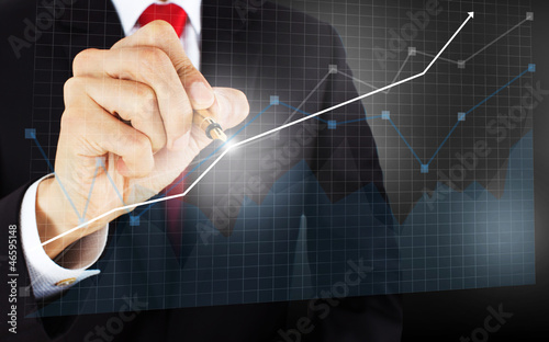 Photo: businessmen draw a graph businessmen draw a graph