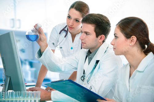Photo: scientists working at the laboratory scientists working at the laboratory