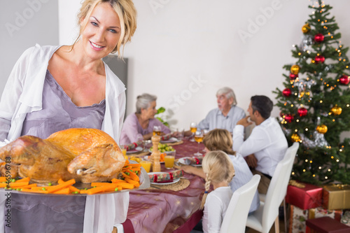 Photo: Proud mother showing roast turkey Proud mother showing roast turkey