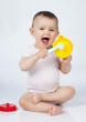 giggling baby playing with toys