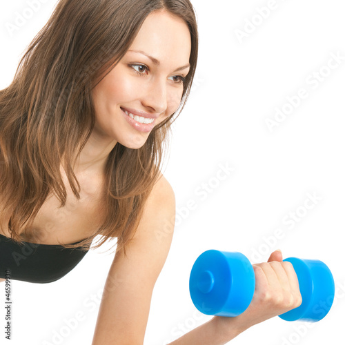 Photo: Young woman exercising with dumbbell, isolated Young woman exercising with dumbbell, isolated