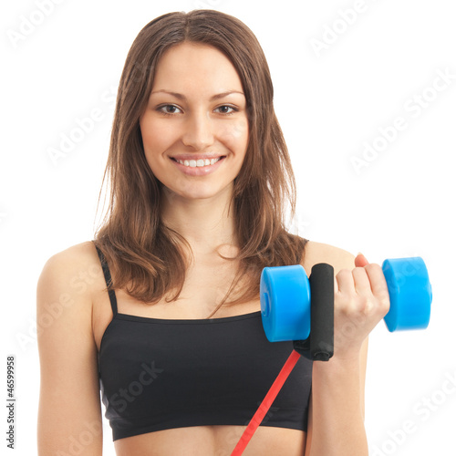 Photo: Young woman exercising with dumbbell, isolated Young woman exercising with dumbbell, isolated