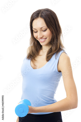 Photo: Young woman exercising with dumbbell, isolated Young woman exercising with dumbbell, isolated