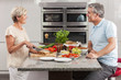 Man Woman Couple Making Sandwiches in Kitchen