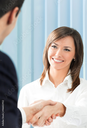 Photo: Cheerful businesspeople handshaking Cheerful businesspeople handshaking