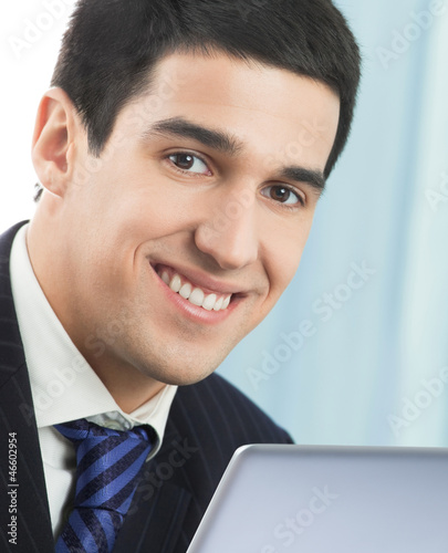 Photo: Businessman working with laptop Businessman working with laptop