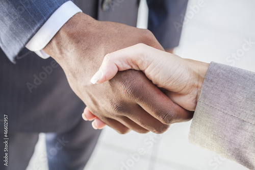 Photo: African American Businessman & Woman Shaking Hands African American Businessman & Woman Shaking Hands