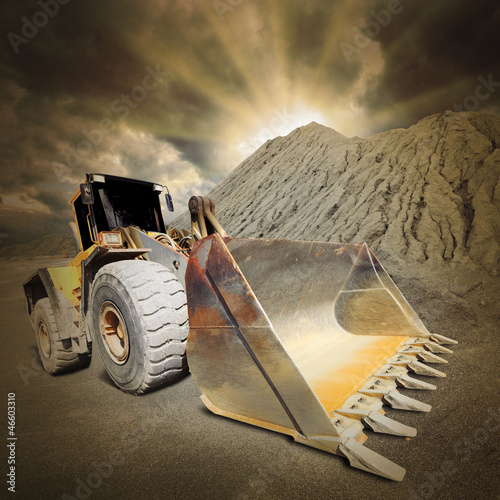 Photo: Excavator in the mine. Ecology disaster concept. Excavator in the mine. Ecology disaster concept.
