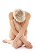 Photo: Beautiful young nude woman sitting on the floor Beautiful young nude woman sitting on the floor