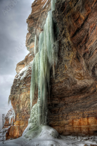 Photo: Long icicles on a cliff Long icicles on a cliff