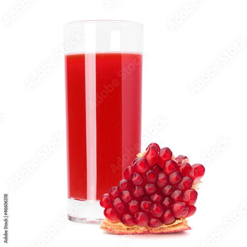 Photo: Juice glass and pomegranate fruit Juice glass and pomegranate fruit