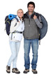 Couple stood with camping equipment