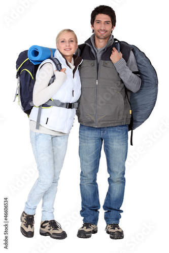 Photo: Couple stood with camping equipment Couple stood with camping equipment