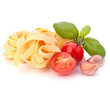 Italian pasta fettuccine nest  and cherry tomato