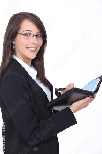 Photo: Young woman with a personal organizer Young woman with a personal organizer