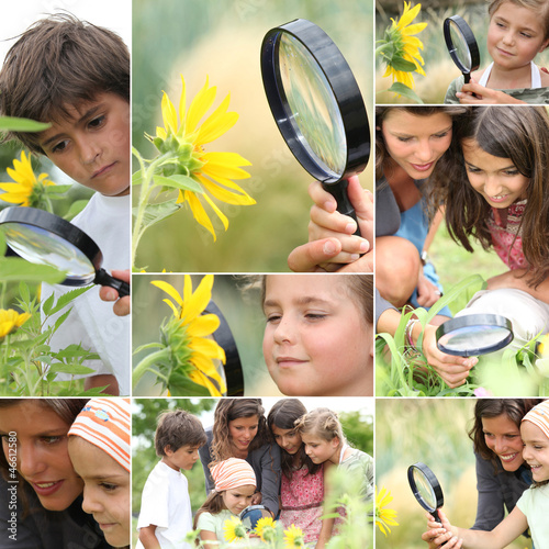 Photo: Family with magnifying glass nature spotting Family with magnifying glass nature spotting