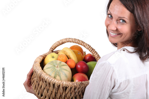 Photo: woman with fruit basket woman with fruit basket