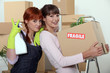 Two female friends moving house