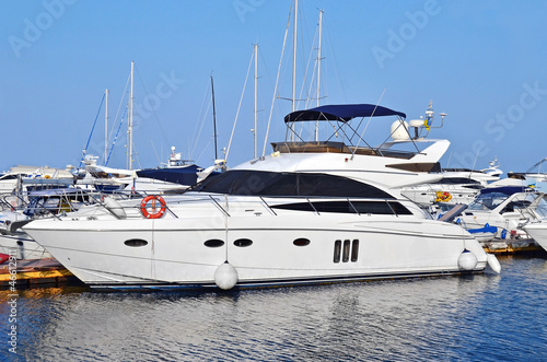 Photo: White motor yacht over harbor pier, Odessa, Ukraine White motor yacht over harbor pier, Odessa, Ukraine