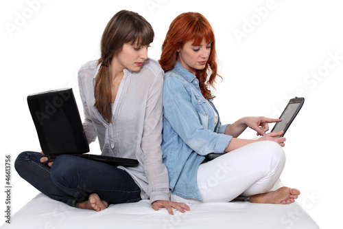 Photo: Two girls with computer Two girls with computer
