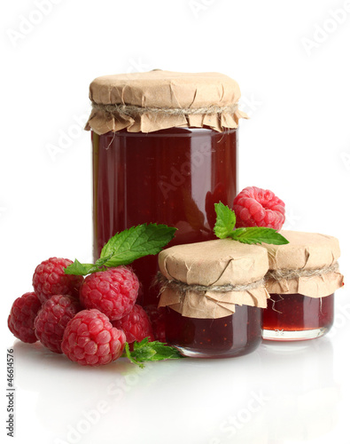 Photo: jars with jam and ripe raspberries with mint isolated on white jars with jam and ripe raspberries with mint isolated on white