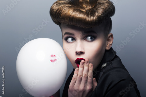 Photo: Expression. Surprised pin-up shopper girl with balloon Expression. Surprised pin-up shopper girl with balloon