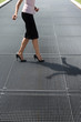 Photo: adult woman trying to balance on high heels shoes adult woman trying to balance on high heels shoes