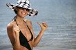 Happy brunette at the seaside