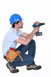 man using screwdriver