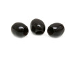 Foto: Three black olives shot on white background Three black olives shot on white background