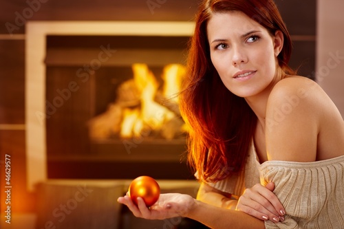 Photo: Smiling beauty with christmas bulb Smiling beauty with christmas bulb