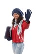 Pretty ethnic woman waving at wintertime