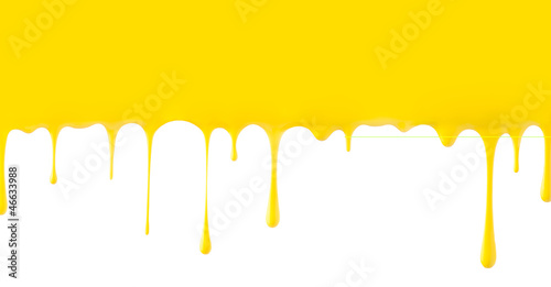 Photo: Yellow paint dripping isolated on white background Yellow paint dripping isolated on white background