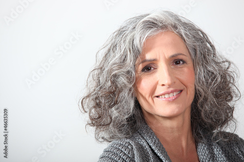 Photo: Grey-haired woman on white background Grey-haired woman on white background