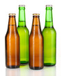 Coloured glass beer bottles isolated on white