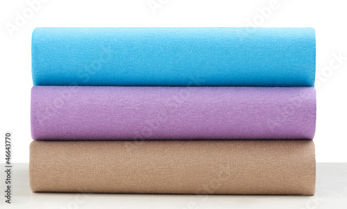 Photo: Colorful shirts or cloths arranges display overlap each other Colorful shirts or cloths arranges display overlap each other