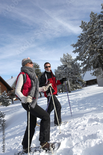 Photo: Couple walking in snowshoes Couple walking in snowshoes