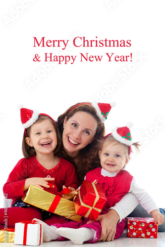 Photo: Happy family celebrating Christmas Happy family celebrating Christmas